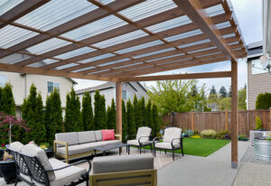 Garden dining area beneath clear Suntuf corrugated roofing panels