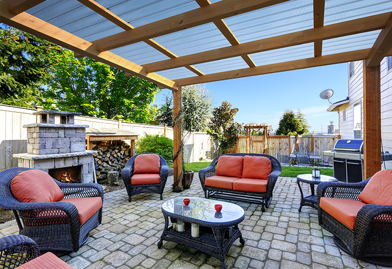 Outdoor seating area beneath Suntuf BH roofing panels